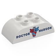 Деталь LEGO Duplo Brick 2 x 4 Curved Top with 'DOCTOR NUDSON;, Red/Blue Serpents around Wrench print, Белый