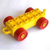 Деталь LEGO Duplo Car Base 2 x 6 with Red Wheels and Old Style Closed Hitch End, Желтый